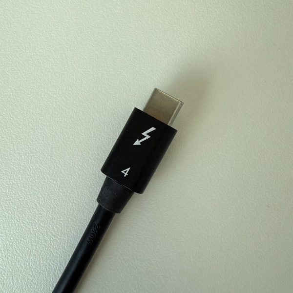 OWC Thunderbolt 4 cable connector showing the Thunderbolt lightning-bolt logo and the number 4.