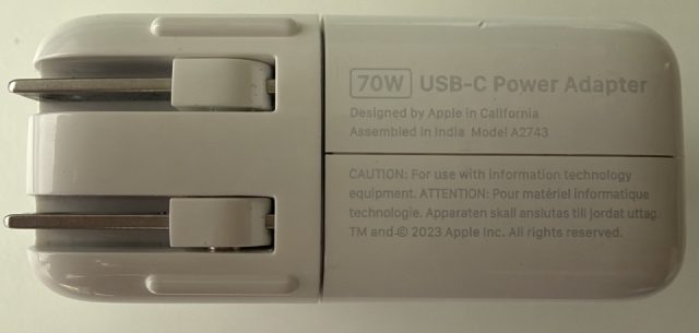 70W USB-C Power Adapter. Designed by Apple in California, Assembled in India. Model A2743. TM and copyright 2023 Apple Inc.